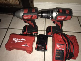 Milwaukee 18v drills with charger,extra battery and drill bits set