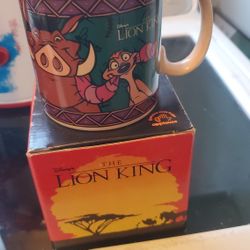 vintage Disney's The Lion King ceramic coffee mug featuring Timon and Pumbaa, known for 