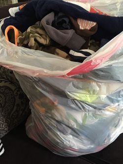 Full bag of baby clothes