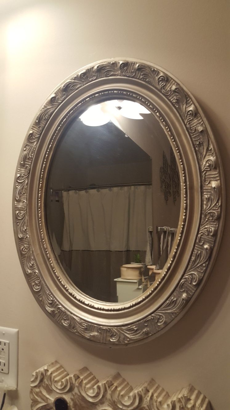 Oval silver wall mirror