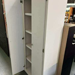 Tall white closet with shelves