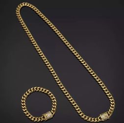 New 18 k yellow gold Cuban link chain and bracelet