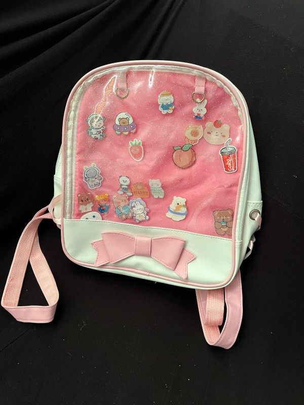 Coquette pink backpack with charms