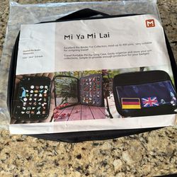 Mi Ya Mi Lai enamel pin binder for collectors.