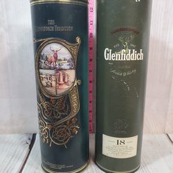 @CHV.  2 EMPTY VINTAGE GLENFIDDICH COLLECTIBLE BOTTLES AND TUBE CASE 