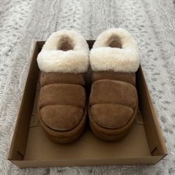 Brown and tan UGG slippers