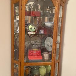 A Corner Curio Cabinet With Light, Very New
