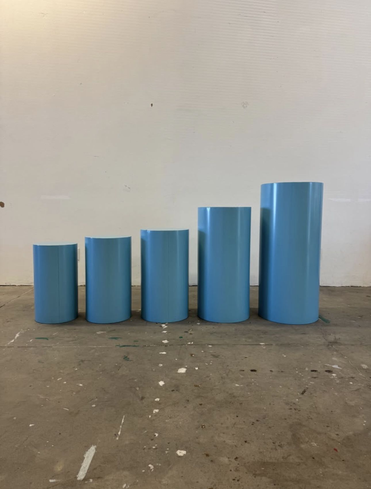 5 Blue Metal Cylinder cake plinths for events