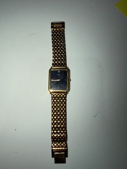 1991 Seiko quartz gold tone tank watch