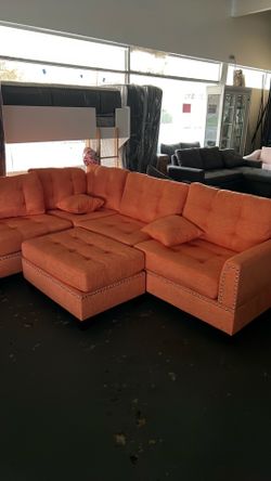 Tangerine pretty orange sectional with accents and FREE OTTOMAN!was $949. Now $499