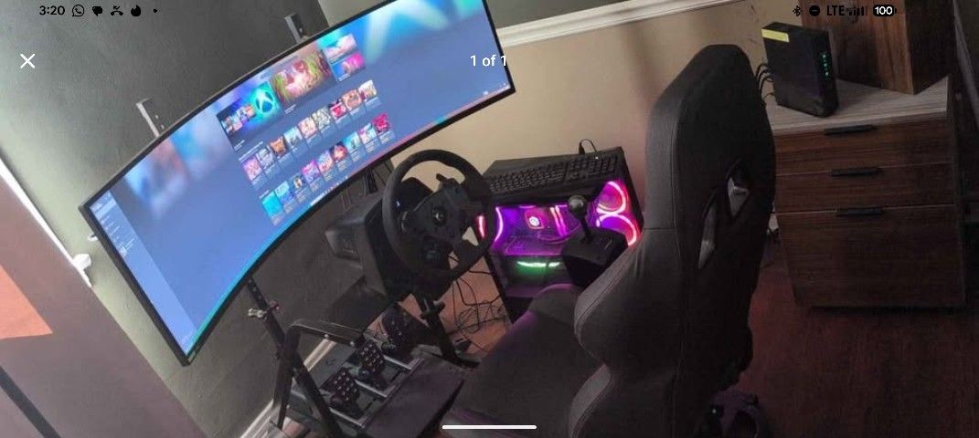Logitech GPro racing simulator with pedals and Odyssey G9 neo curved gaming monitor
