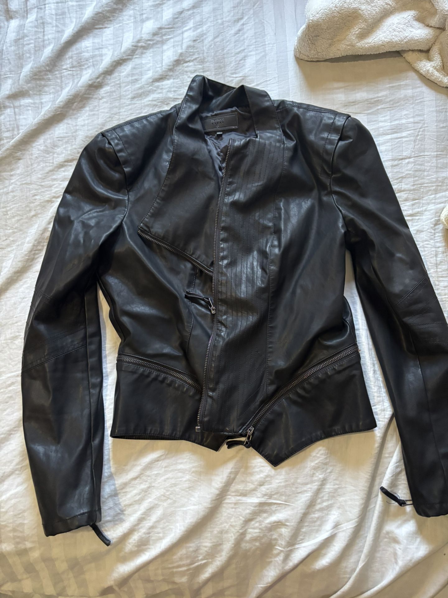 Black leather jacket with zipper detail and inside pockets