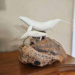Vtg. John Perry Mother & Calf Whale sculpture on a natural burl base.