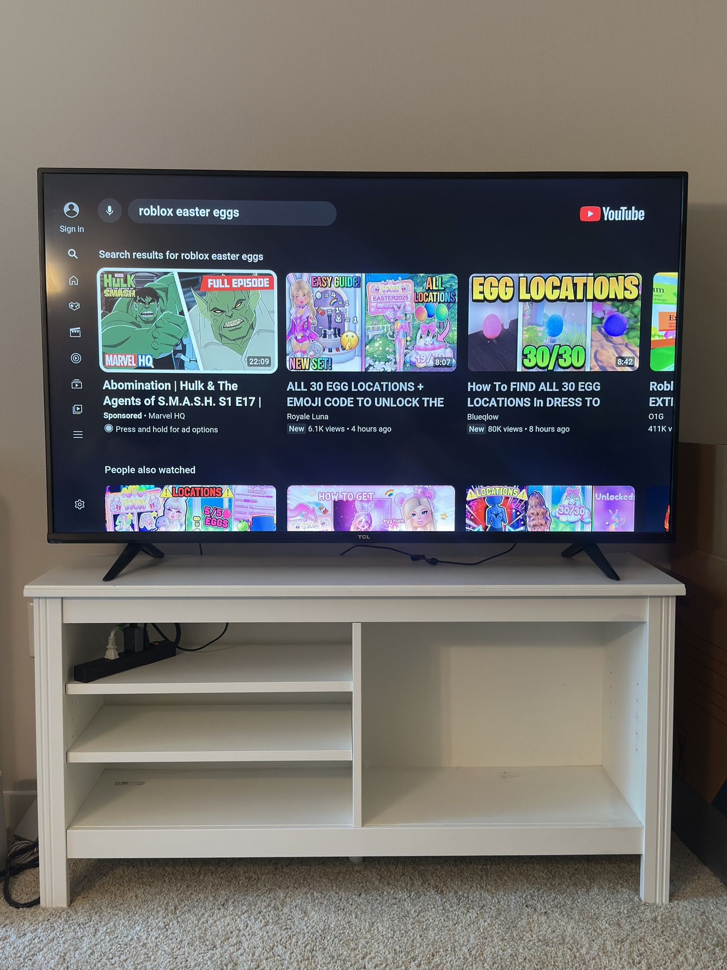 55” 4K TV with elegant TV stand and Roku + box