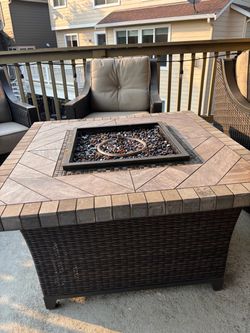 Patio Furniture- 4 swivel chairs and a fireplace center