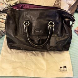 Black Coach purse with purple interior