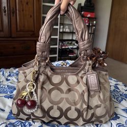 Brown and tan Coach shoulder bag