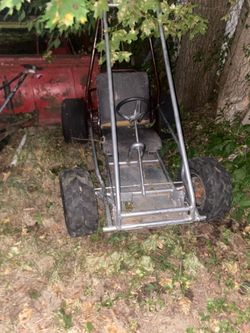 Silver and burgundy go cart
