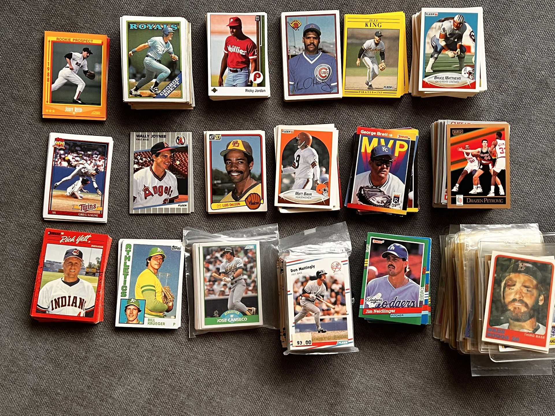Baseball, American football, and basketball cards.