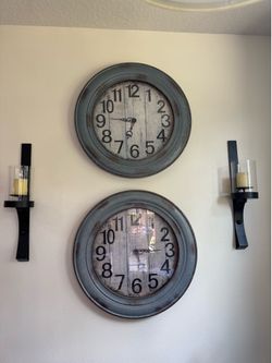 2 large clocks and candle holders