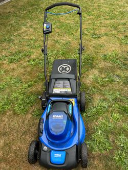 Kobalt lawnmower, weed eater, and leaf blower.