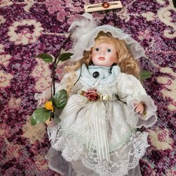 Swinging Porcelain Doll