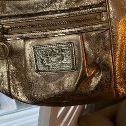 Coach purse the leather is gold color