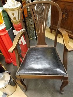 Antique Solid wood ornate carved back leather seat arm chair