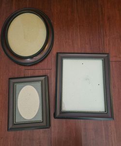 Three brown photo frames