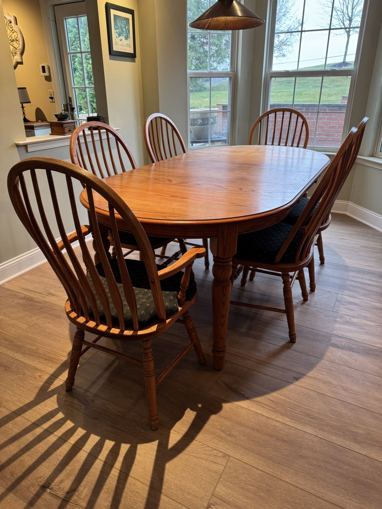 wood kitchen table with 6 chairs and 4 stools