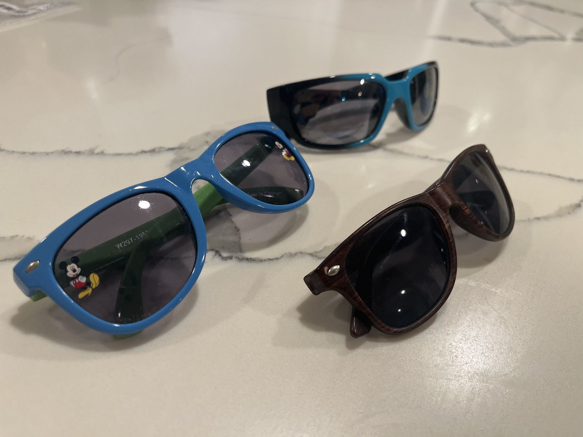 Three Pairs Of Kid Sunglasses 