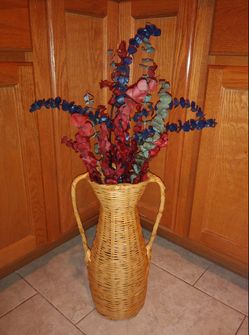 Decorative flowers in tall pot