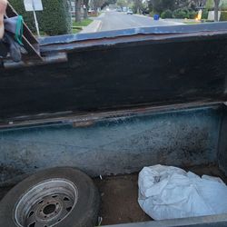 UTILITY  TRAILER WITH RAMP AND STORAGE  ENCLOSURE.