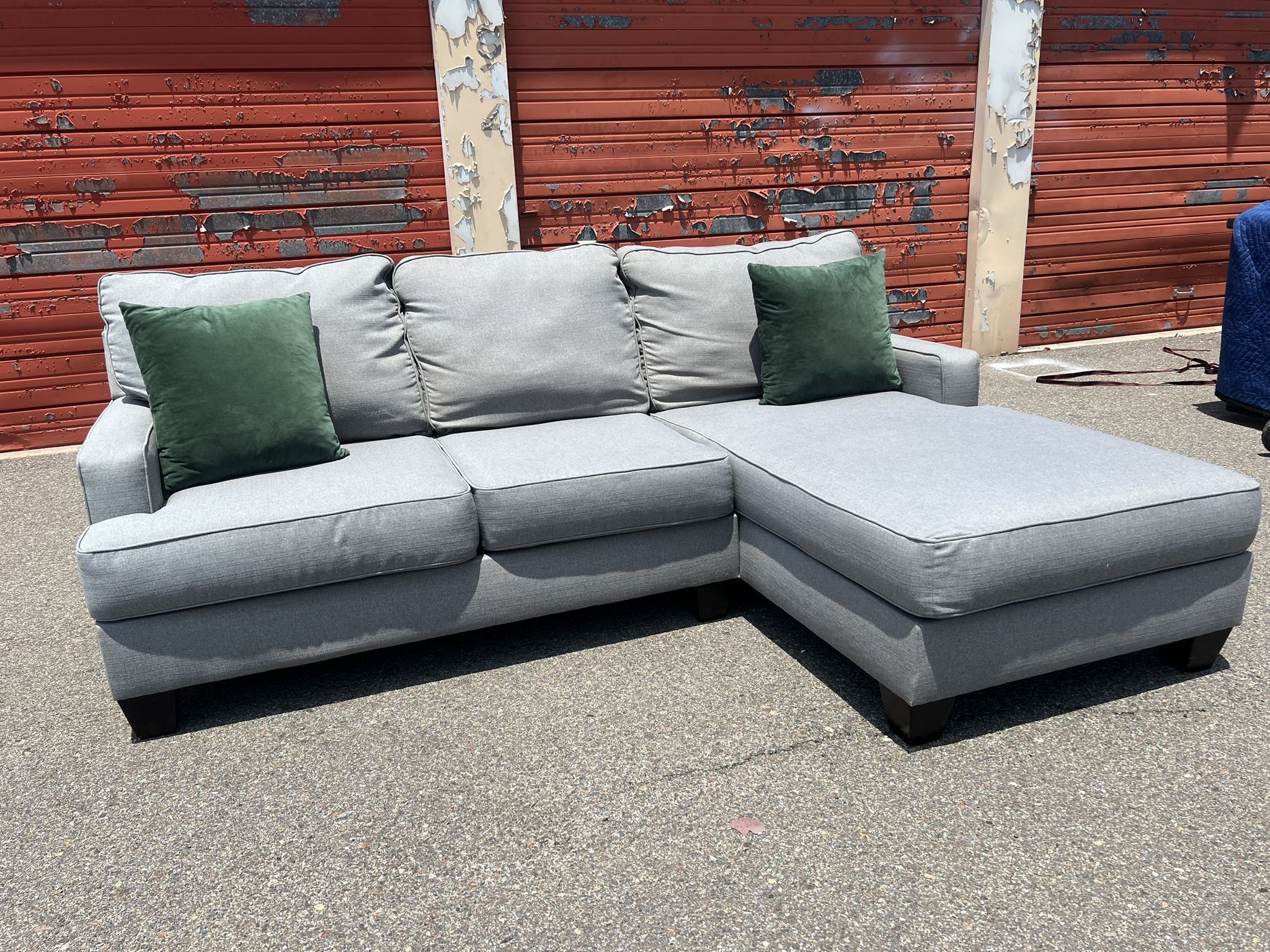 Ashley’s Gray Sectional Sofa Couch with right facing chaise