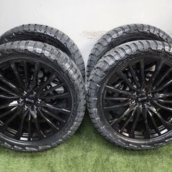 NEW 24 inch gloss black gm style wheels wrapped in 35x13.50R24 RBP