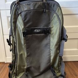 Eagle Creek Switchback International Carry-On rolling backpack in green/grey.