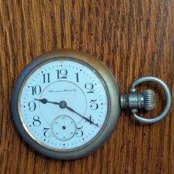 Old antique LARGE Hampden pocket watch from 1800s? Big heavy cool item. Movement looks clean but not working. Back has some discoloration on metal. 