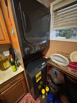 GE Black Stacked Washer Dryer Unit