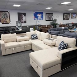 Beige Sofa Sectional w/ Pull-out Sleeper & Drop Down Cup holders 