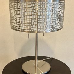 Two Lamps And A Small Stand 