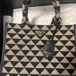 Large Prada Symbole embroidered fabric handbag