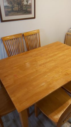 Dinning room table with 6 chairs. 60"×40" has leaf that makes it a 60"×60" square. Solid table with stable chairs.
