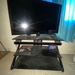 LG TV with Glass TV Stand Included 