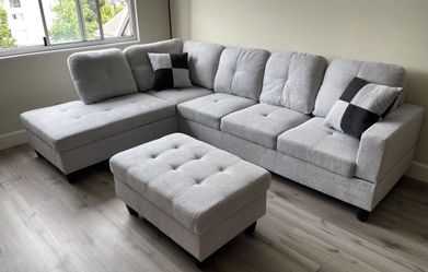 Gray linen sectional couch and ottoman
