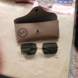 Ray-Ban sunglasses.