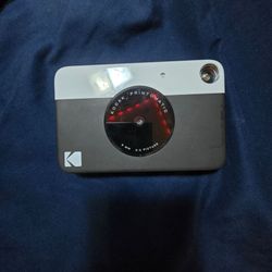 Black Kodak Printomatic digital instant print camera