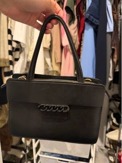 Chic Black Top-Handle Bag with Dark Chain Detail