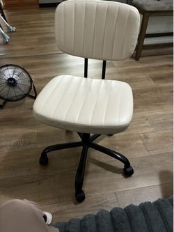 Beige/tan desk chair spins & rolls