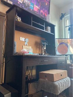 Dark wooden office desk w bulletin board