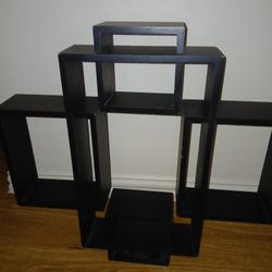 Multiple Sections On This Black Unique Design Of Floating Shelves